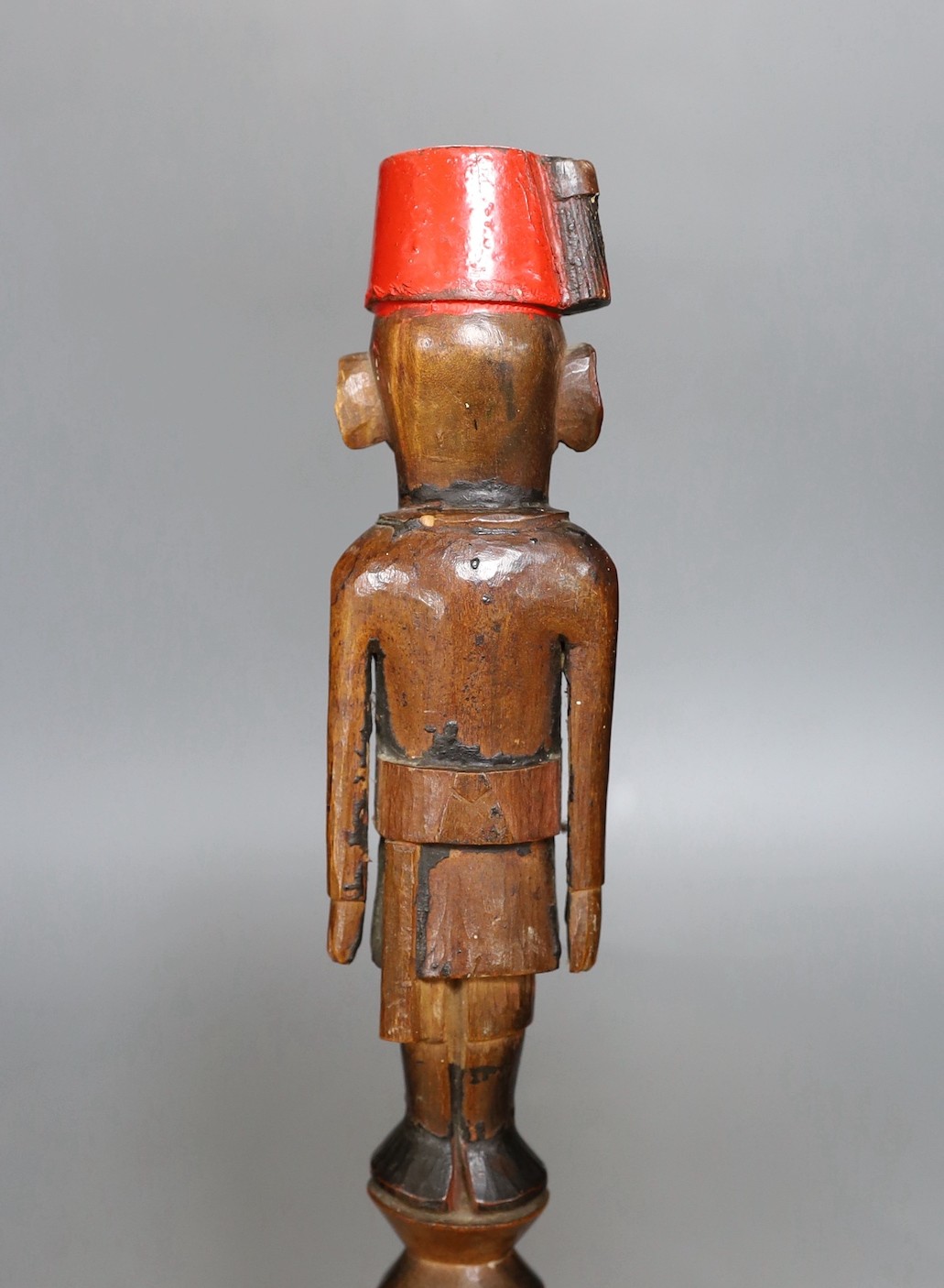 An early 20th century Nyassaland figural carved walking cane (Kings African Rifles) 87cm long